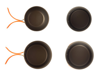 Top view of camping pots set set with silicone handle. Outdoor cookware equipment isolated on white background