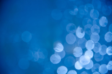 Abstract glitter blue bokeh background