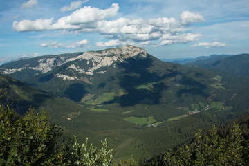 Fototapeta premium Nice clouds above the Heukuppe, the highest mountain of Rax in Lower Austria, Europe