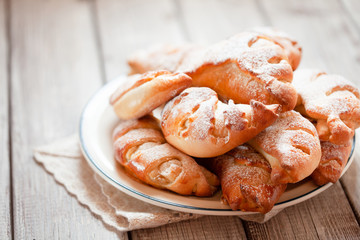 Homemade sweet rolled bun with custard filling and sugar powder