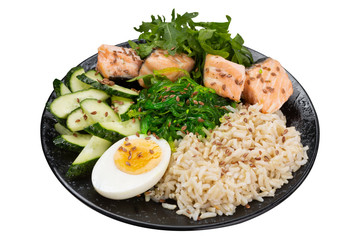 Buddha bowl, wholesome food, boiled rice and salmon, cucumbers and egg, with their seaweed salad