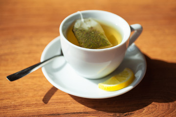 hot Cup of tea. On wooden background