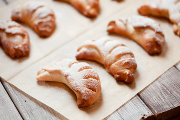 Homemade sweet rolled bun with custard filling and sugar powder