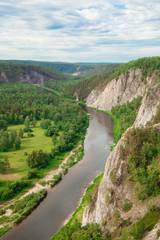 Fototapeta na wymiar Beautiful natural scenery of the river in Russia with mountains