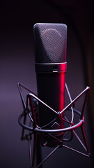 studio condenser microphone, with gradient background and red light