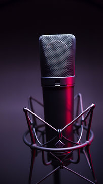 studio condenser microphone, with gradient background and red light