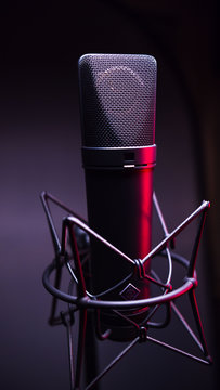 studio condenser microphone, with gradient background and red light