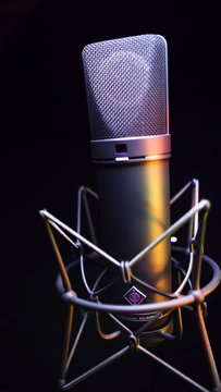 studio condenser microphone, isolated on black. with Amber Light