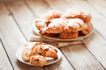 Homemade sweet rolled bun with custard filling and sugar powder