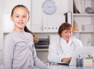 Fototapeta premium Adult female doctor leading medical appointment