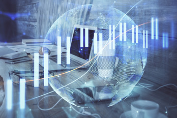Financial market graph hologram and personal computer on background. Double exposure. Concept of forex.