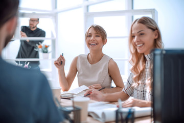 young business woman sitting at office Desk