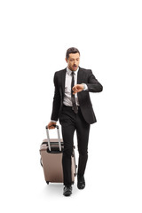 Businessman with a suitcase going on a business trip and checking his watch