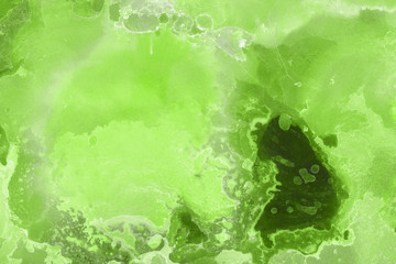Hand painted alcohol ink background. Abstract delicate green texture. Contemporary wallpaper. 