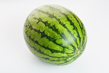 Watermelon with striped peel on a white isolated background. Variety of watermelon yellow