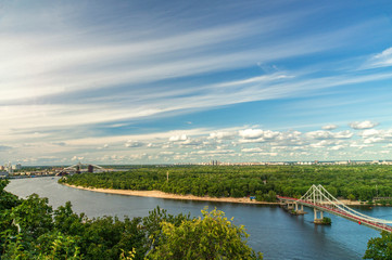 Fototapeta premium Cityscape, view of the Dnieper river and the bridge in Kiev from a height