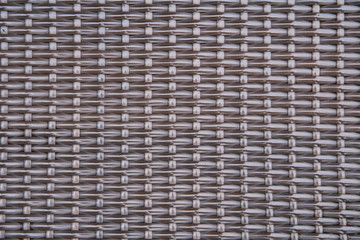 brown rattan pattern. Background of basket structure close-up. Furniture backdrop. Rattan texture, detail handcraft. Old rattan  texture background.