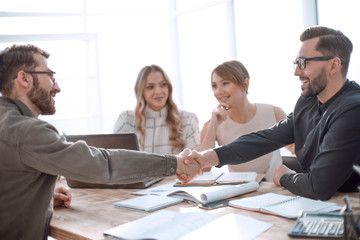 handshake business people at a meeting in the office