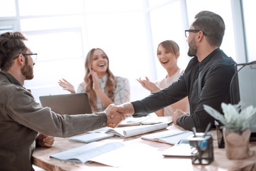 handshake business people at a meeting in the office
