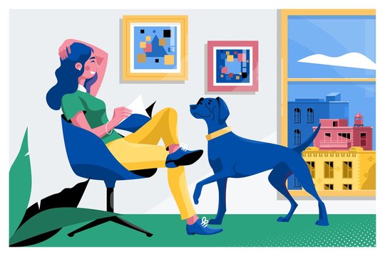 Girl reading a book and dog sitting on the armchair