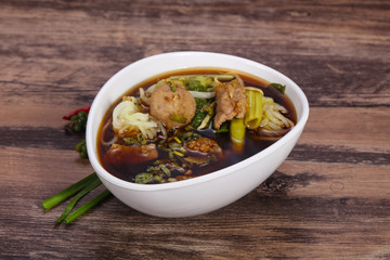 Thai style soup with meat and mushrooms