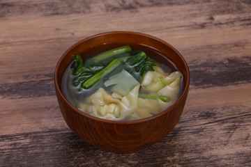 Asian traditional Wonton soup with herbs