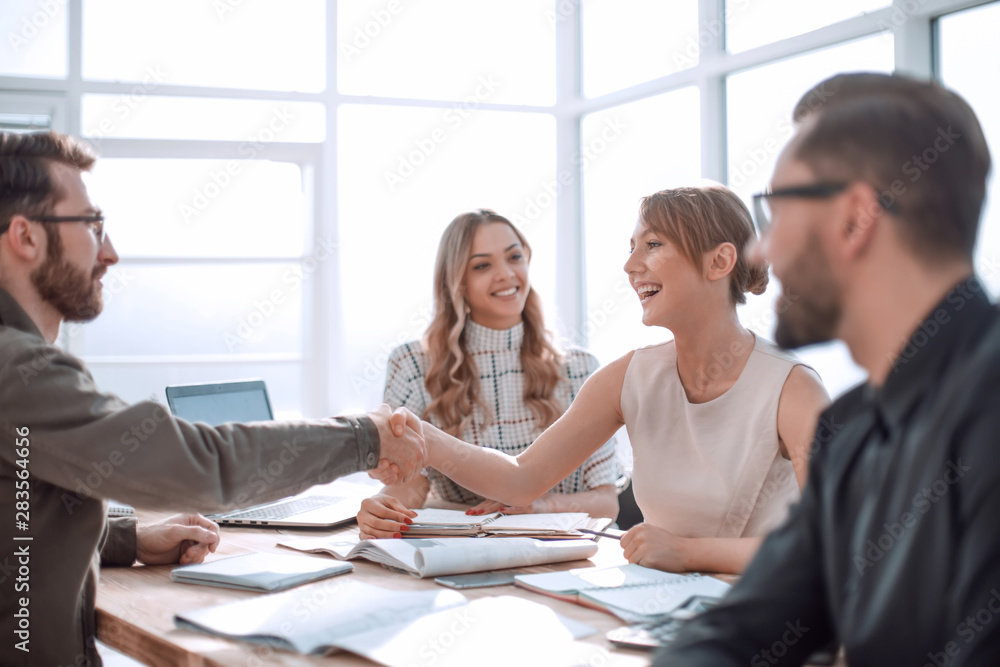 Poster businessman looking at the handshake of business partners