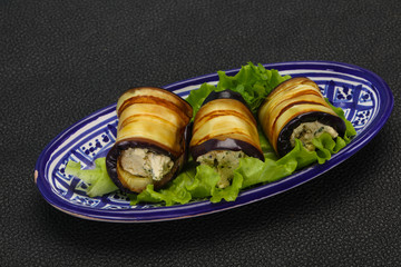 Stuffed eggplant roll with cheese and herbs