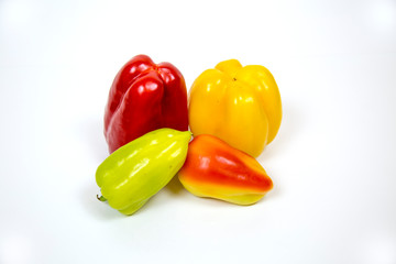 Sweet bell pepper red yellow green isolated on white background. Useful vegetables and fruits. Food drinks.