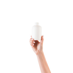 Female hand holding cream bottle of lotion isolated. Girl give tube cosmetic products on white...