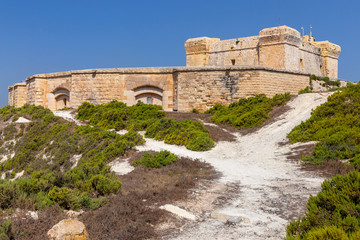 Marsaxlokk. The old stone tower of St. Lucian.