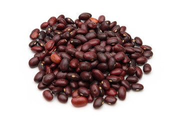 A bunch of raw red beans on a white background