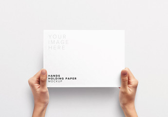 Hands Holding Paper Mockup