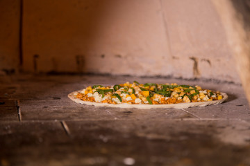 Traditional way baked wood fired oven Italian pizza