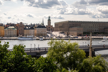 View of central Stockholm, Sweden. Foregound: Skeppsholmsbron, the bridge leading to Skeppsholmen island. Background: Royal Palace, Storkyrkan church in Gamla Stan (Old Town)