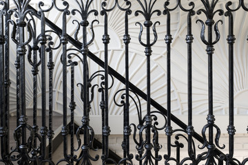 Decorative, forged banisters, fence in old style in interior