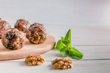 vegetarian food, energy balls of walnuts, dates, prunes, cranberries and honey