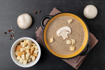 Champignon mushroom cream soup in a black bowl
