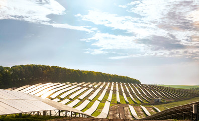 Rows of solar panels on the steep hills of the field