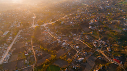 A picturesque village at sunrise, shot from above.