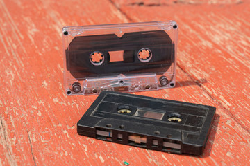 several old film audio cassettes on a wooden table