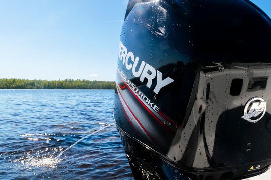 Helsinki, Finland, May 20, 2019: Modern new fishing sport boat with a brand new Mercury FourStroke outboard engine on the lake.
