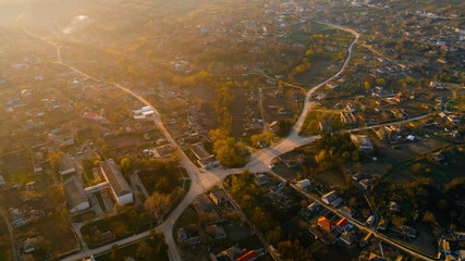 A lovely shot of a beautiful village during sunrise, aerial view.