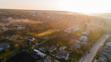A stunning shot of an alluring village at sunrise, aerial view.