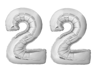 Number 22 twenty two made of silver inflatable balloons isolated on white background. Silver chrome helium balloons forming 22 twenty two number