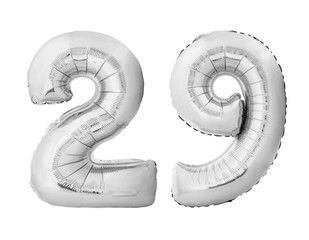 Number 29 twenty nine made of silver inflatable balloons isolated on white background. Silver...