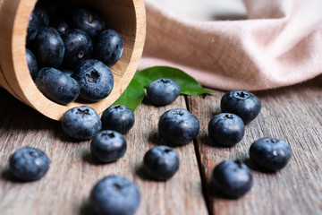 Freshly blueberries in wooden bucket