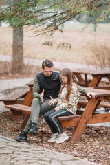 Obraz premium Father and cute daughters with dog outdoors