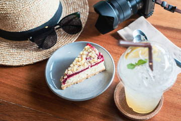 Close up of cake, lemonade soda in cafe.