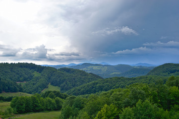 Fototapeta na wymiar Gathering storm over the mountains of Transilvania